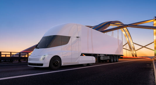 Tesla's Electric truck driving down the highway 
